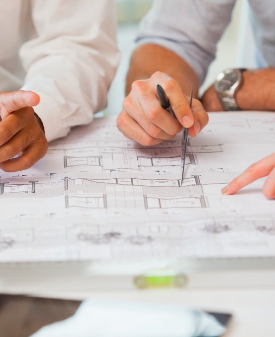 project-managers-team-blueprints-in-the-office project-managers-team-blueprints-in-the-office